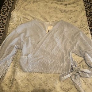 Pin striped long sleeve wrap around top